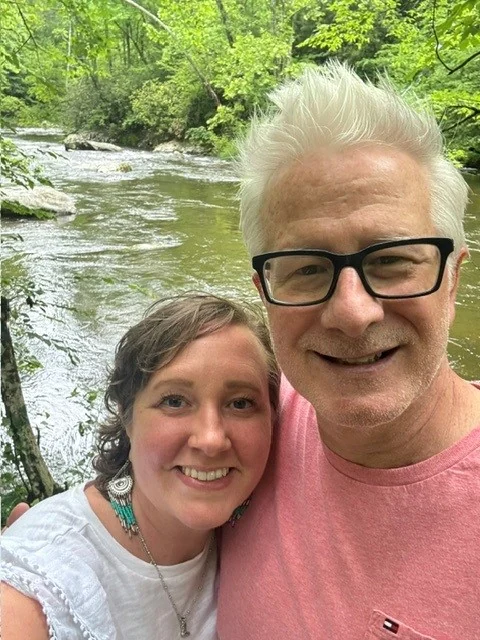 Joe Thielmann and Kathryn Parciak beside a mountain stream near the Rainbow Falls trail in the Smokies